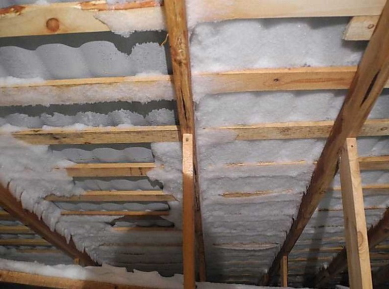 An example of peeling metal tiles from the attic side
